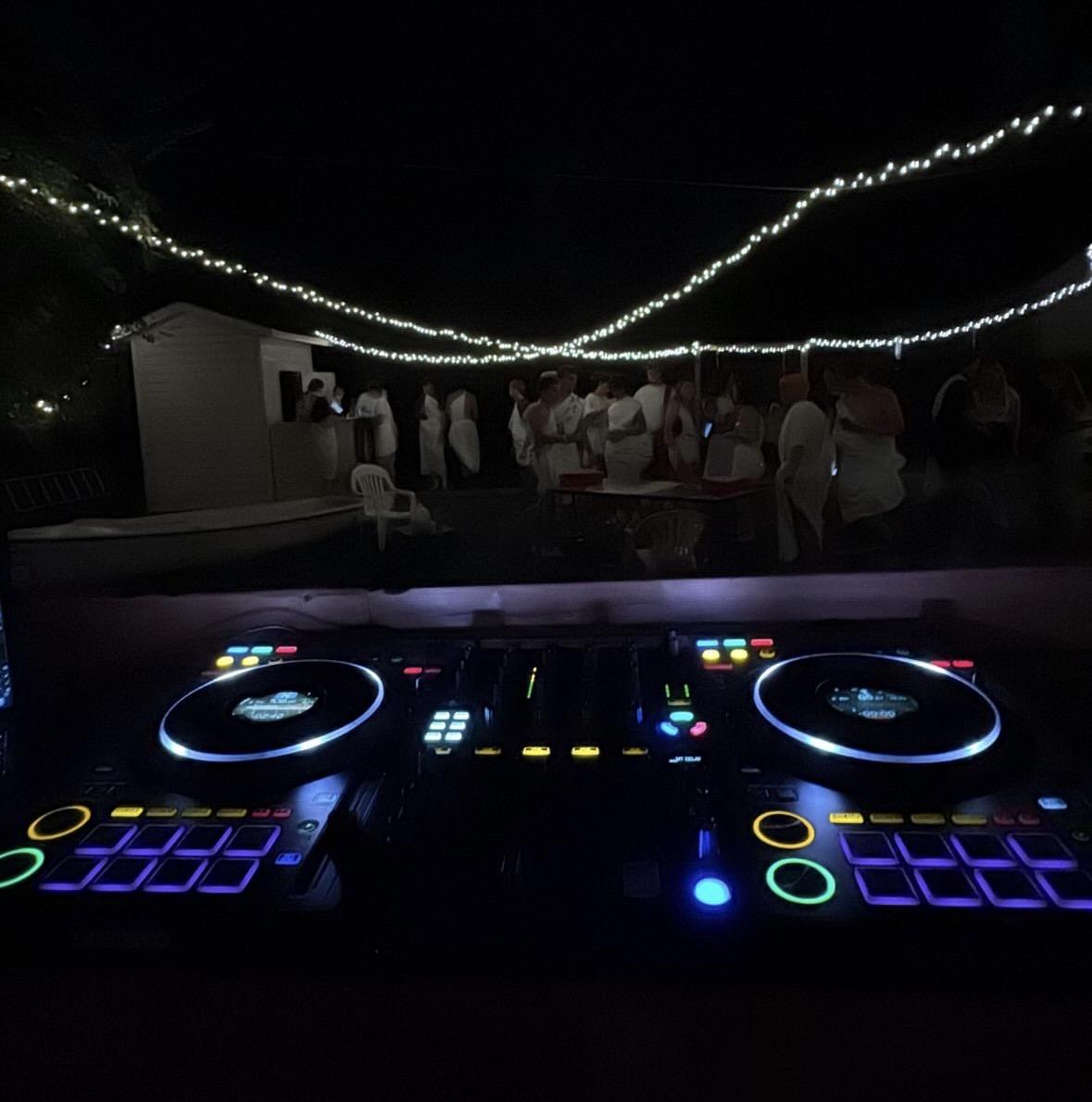 Backyard nighttime event from behind the controller