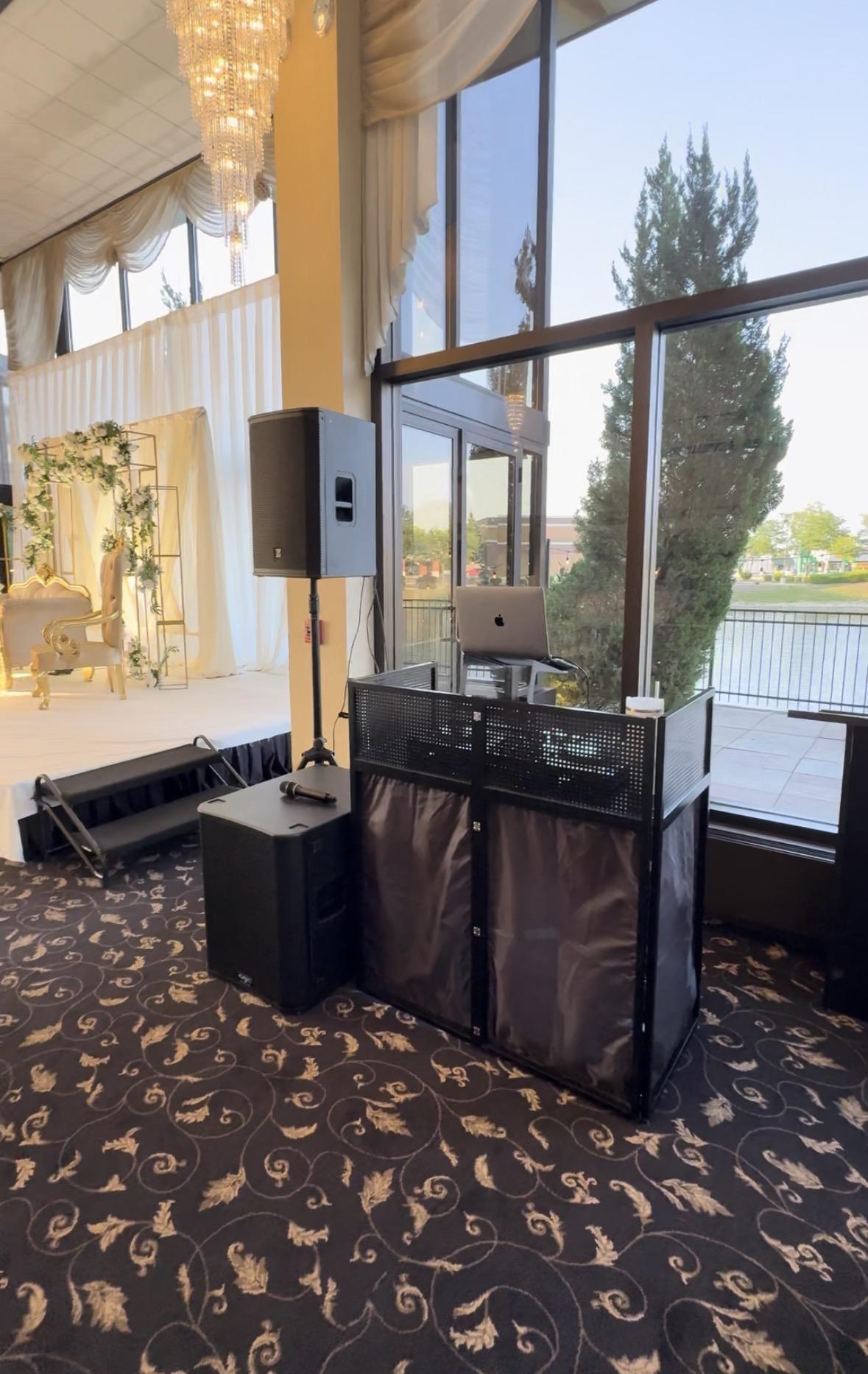 BOK Music booth and speaker setup in a ballroom