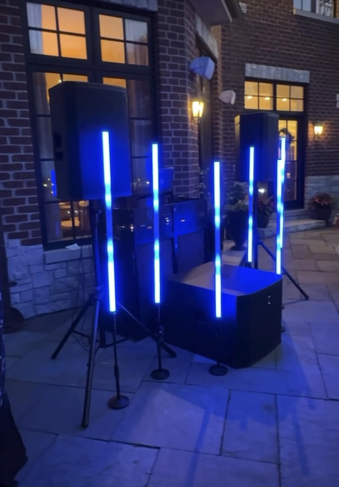 Blue-lit speaker and lighting setup