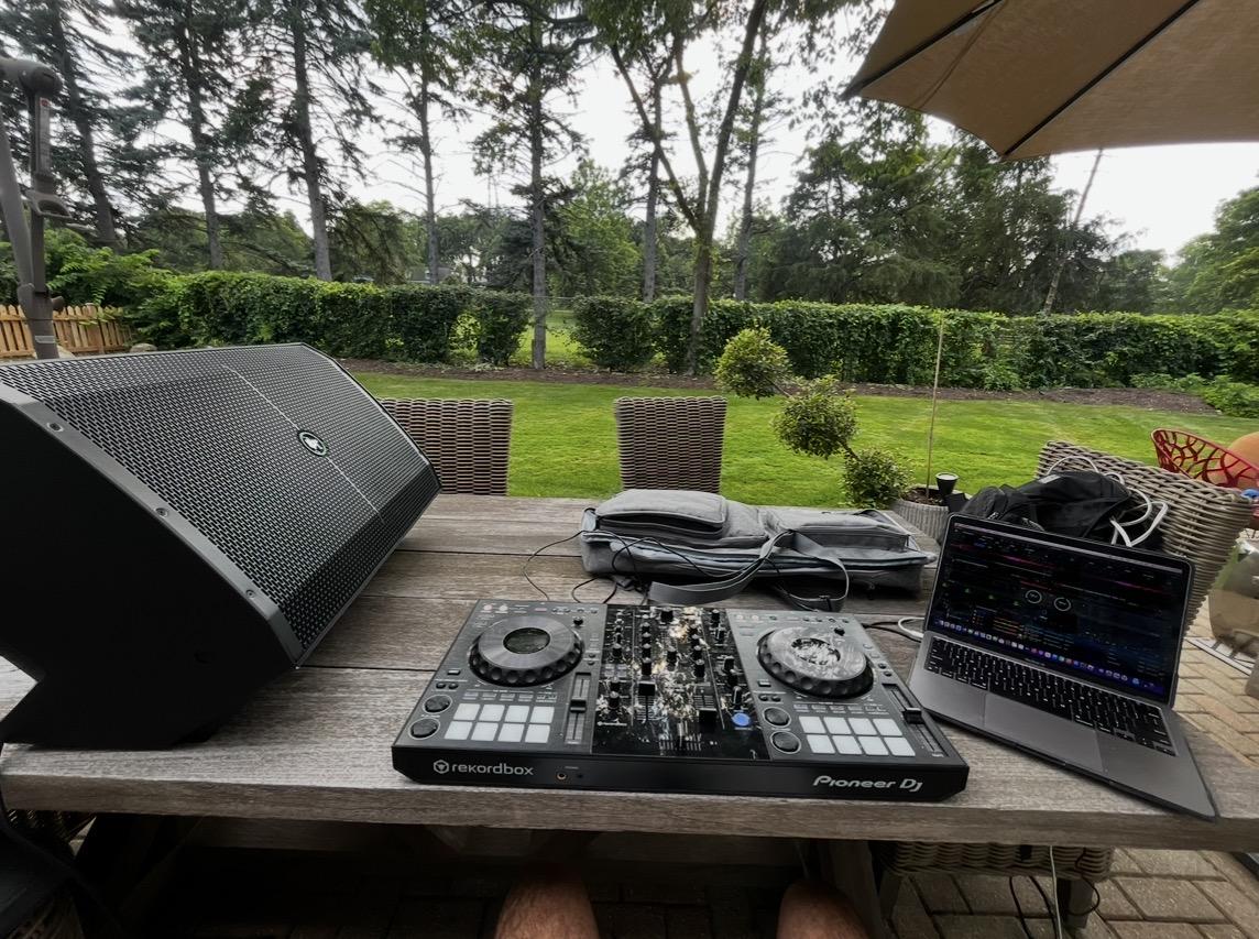 DJ controller and speaker setup outdoors