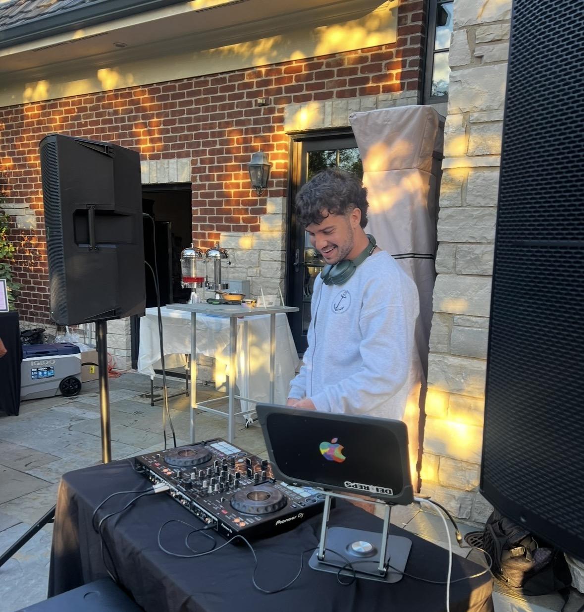 Gabe mixing music outdoors